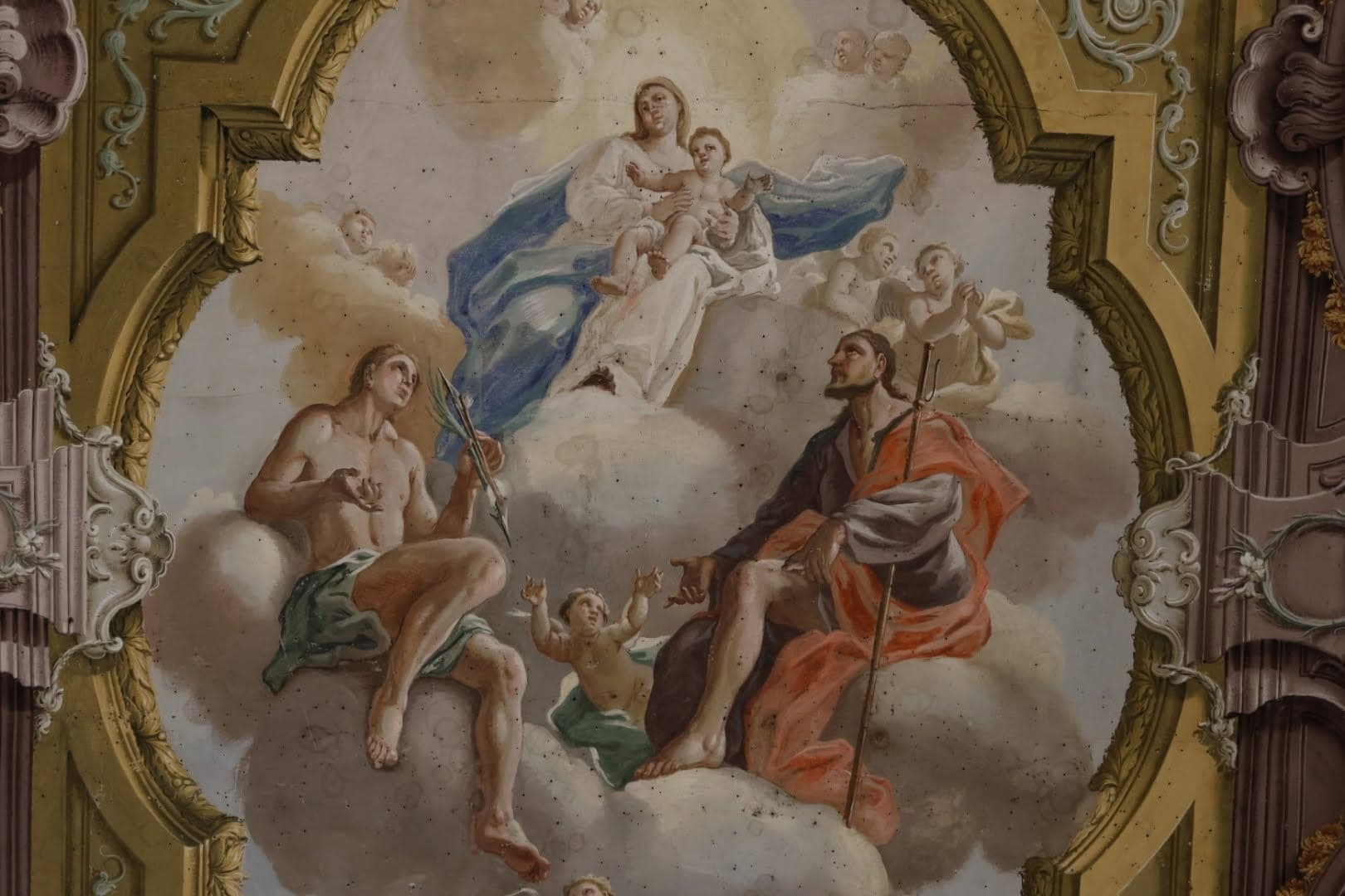 La Madonna con il Bambino in gloria, con San Sebastiano e un santo pellegrino