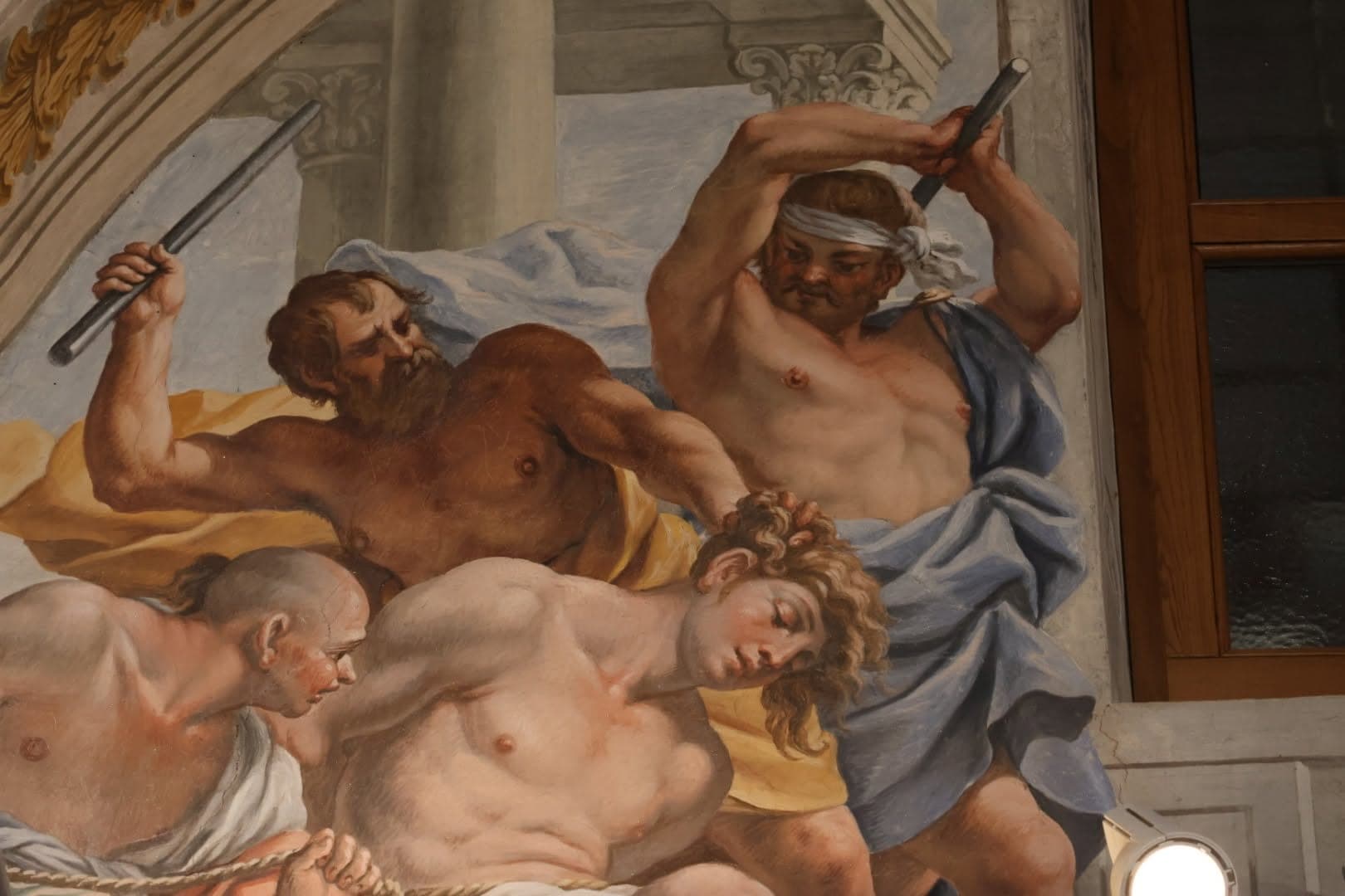 Scena del martirio di San Sebastiano, colpito con i bastoni
